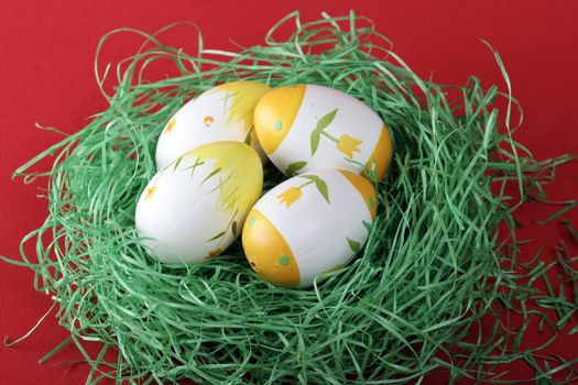 Painted easter eggs in grass.