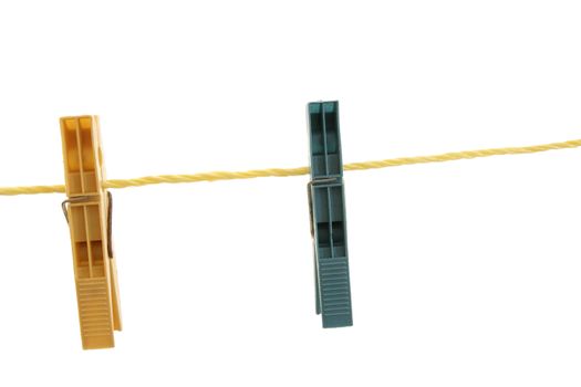 close up of clothespins on a line 
