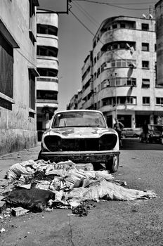 Trash and wrecked car on the street