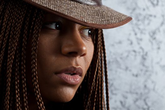 horizontal portrait of a young black woman in hat