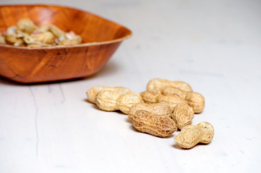 Peanuts in a brown bowl