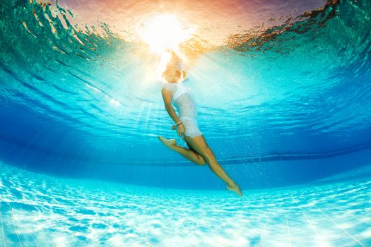 underwater swimming and reflection in water