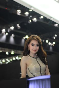 BANGKOK, THAILAND - MARCH 30, 2014: Unidentified female presenter pose in the 35th Bangkok International Motor Show on March 30, 2014 in Nonthaburi, Thailand.