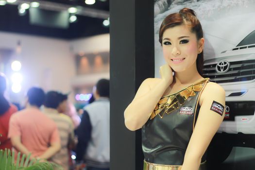 BANGKOK, THAILAND - MARCH 30, 2014: Unidentified female presenter pose in the 35th Bangkok International Motor Show on March 30, 2014 in Nonthaburi, Thailand.