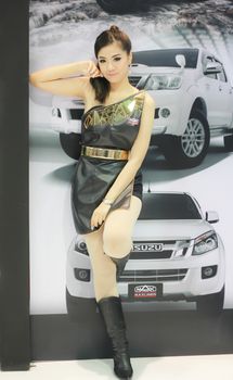 BANGKOK, THAILAND - MARCH 30, 2014: Unidentified female presenter pose in the 35th Bangkok International Motor Show on March 30, 2014 in Nonthaburi, Thailand.