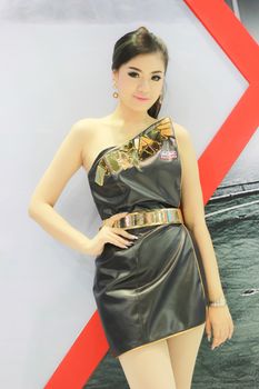 BANGKOK, THAILAND - MARCH 30, 2014: Unidentified female presenter pose in the 35th Bangkok International Motor Show on March 30, 2014 in Nonthaburi, Thailand.