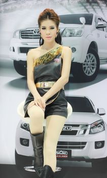 BANGKOK, THAILAND - MARCH 30, 2014: Unidentified female presenter pose in the 35th Bangkok International Motor Show on March 30, 2014 in Nonthaburi, Thailand.