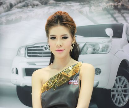 BANGKOK, THAILAND - MARCH 30, 2014: Unidentified female presenter pose in the 35th Bangkok International Motor Show on March 30, 2014 in Nonthaburi, Thailand.