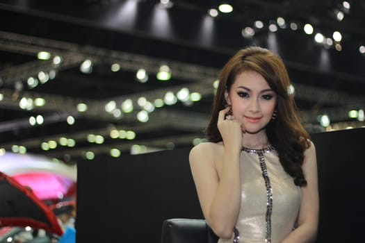 BANGKOK, THAILAND - MARCH 30, 2014: Unidentified female presenter pose in the 35th Bangkok International Motor Show on March 30, 2014 in Nonthaburi, Thailand.