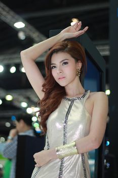 BANGKOK, THAILAND - MARCH 30, 2014: Unidentified female presenter pose in the 35th Bangkok International Motor Show on March 30, 2014 in Nonthaburi, Thailand.