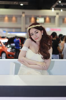 BANGKOK, THAILAND - MARCH 30, 2014: Unidentified female presenter pose in the 35th Bangkok International Motor Show on March 30, 2014 in Nonthaburi, Thailand.