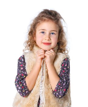 A beautiful young girl dressed for winter, over a white background