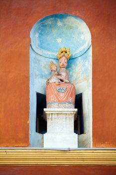 BUDAPEST, HUNGARY - AUGUST 2: Virgin Mary carrying the baby Jesus on a house facade in Budapest, Hungary