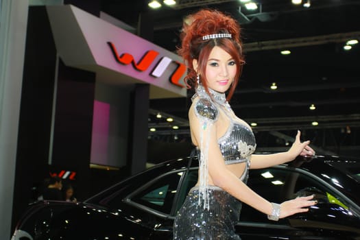 BANGKOK, THAILAND - MARCH 30, 2014: Unidentified female presenter pose in the 35th Bangkok International Motor Show on March 30, 2014 in Nonthaburi, Thailand.