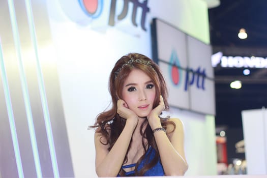 BANGKOK, THAILAND - MARCH 30, 2014: Unidentified female presenter pose in the 35th Bangkok International Motor Show on March 30, 2014 in Nonthaburi, Thailand.