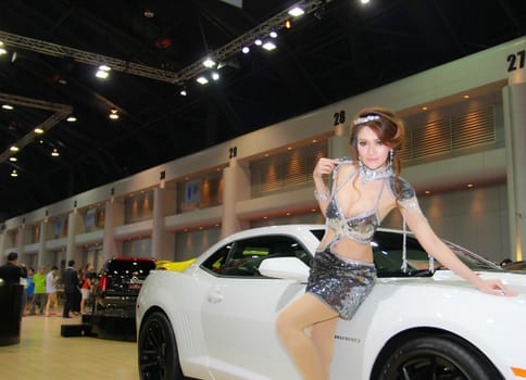 BANGKOK, THAILAND - MARCH 30, 2014: Unidentified female presenter pose in the 35th Bangkok International Motor Show on March 30, 2014 in Nonthaburi, Thailand.