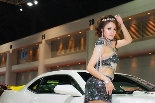 BANGKOK, THAILAND - MARCH 30, 2014: Unidentified female presenter pose in the 35th Bangkok International Motor Show on March 30, 2014 in Nonthaburi, Thailand.