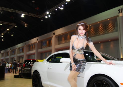 BANGKOK, THAILAND - MARCH 30, 2014: Unidentified female presenter pose in the 35th Bangkok International Motor Show on March 30, 2014 in Nonthaburi, Thailand.