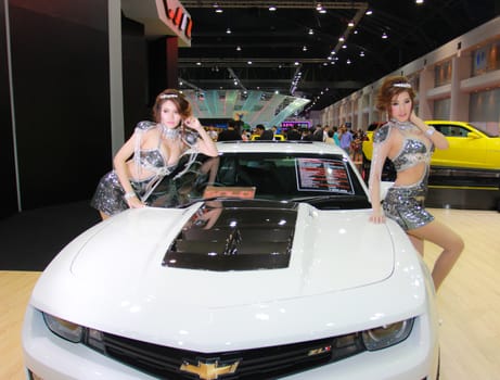 BANGKOK, THAILAND - MARCH 30, 2014: Unidentified female presenter pose in the 35th Bangkok International Motor Show on March 30, 2014 in Nonthaburi, Thailand.