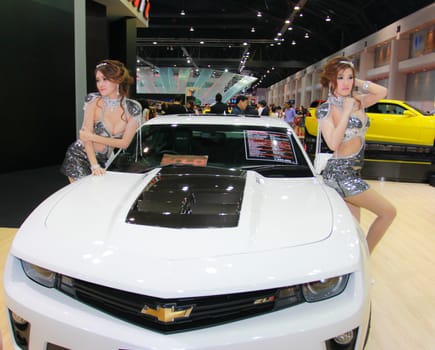 BANGKOK, THAILAND - MARCH 30, 2014: Unidentified female presenter pose in the 35th Bangkok International Motor Show on March 30, 2014 in Nonthaburi, Thailand.