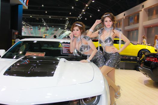 BANGKOK, THAILAND - MARCH 30, 2014: Unidentified female presenter pose in the 35th Bangkok International Motor Show on March 30, 2014 in Bangkok, Thailand.