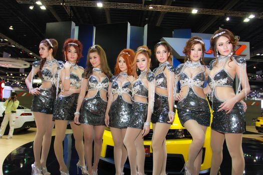 BANGKOK, THAILAND - MARCH 30, 2014: Unidentified female presenter pose in the 35th Bangkok International Motor Show on March 30, 2014 in Bangkok, Thailand.