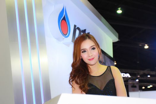 BANGKOK, THAILAND - MARCH 30, 2014: Unidentified female presenter pose in the 35th Bangkok International Motor Show on March 30, 2014 in Bangkok, Thailand.