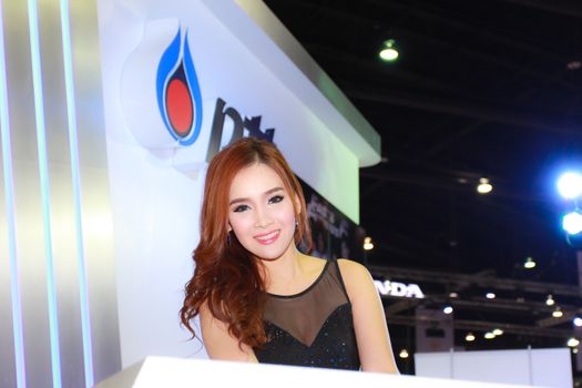 BANGKOK, THAILAND - MARCH 30, 2014: Unidentified female presenter pose in the 35th Bangkok International Motor Show on March 30, 2014 in Bangkok, Thailand.