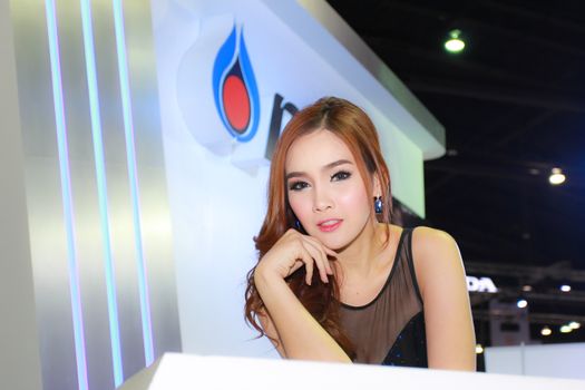 BANGKOK, THAILAND - MARCH 30, 2014: Unidentified female presenter pose in the 35th Bangkok International Motor Show on March 30, 2014 in Bangkok, Thailand.