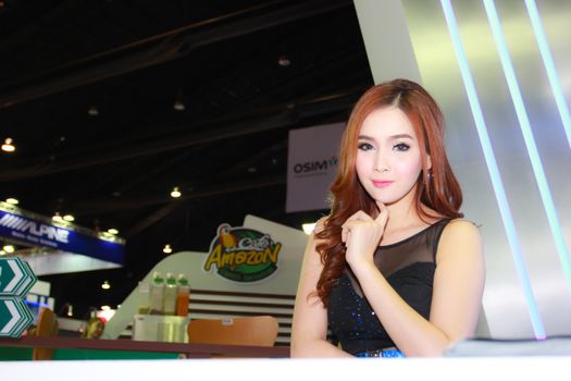 BANGKOK, THAILAND - MARCH 30, 2014: Unidentified female presenter pose in the 35th Bangkok International Motor Show on March 30, 2014 in Bangkok, Thailand.