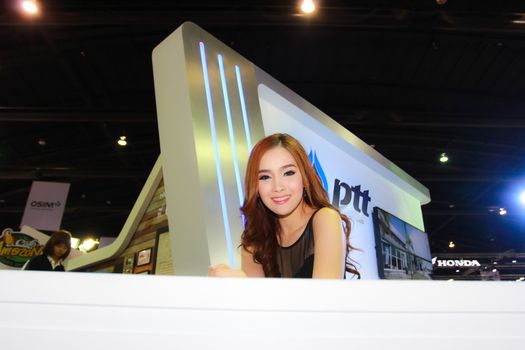 BANGKOK, THAILAND - MARCH 30, 2014: Unidentified female presenter pose in the 35th Bangkok International Motor Show on March 30, 2014 in Bangkok, Thailand.