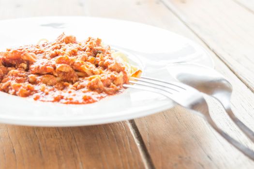 Serving plate of spaghetti tomato pork sauce, stock photo