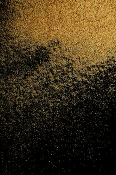 The sand on the black background close-up