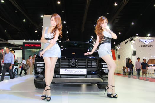 BANGKOK, THAILAND - MARCH 30, 2014: Unidentified female presenter pose in the 35th Bangkok International Motor Show on March 30, 2014 in Bangkok, Thailand.