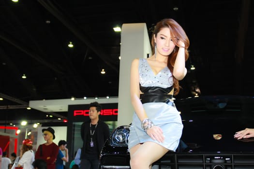 BANGKOK, THAILAND - MARCH 30, 2014: Unidentified female presenter pose in the 35th Bangkok International Motor Show on March 30, 2014 in Bangkok, Thailand.