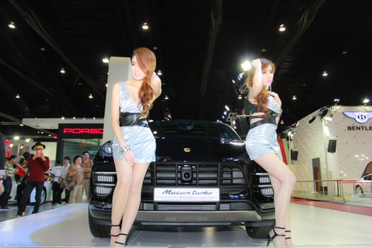 BANGKOK, THAILAND - MARCH 30, 2014: Unidentified female presenter pose in the 35th Bangkok International Motor Show on March 30, 2014 in Bangkok, Thailand.