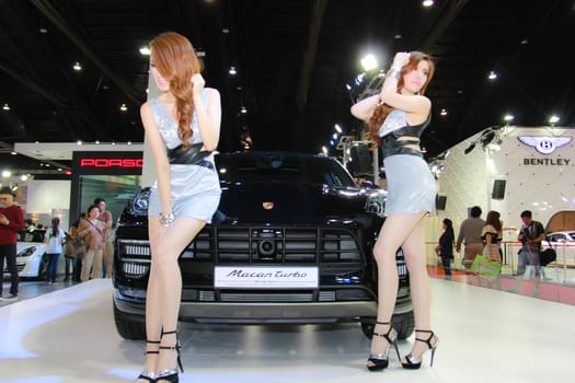 BANGKOK, THAILAND - MARCH 30, 2014: Unidentified female presenter pose in the 35th Bangkok International Motor Show on March 30, 2014 in Bangkok, Thailand.