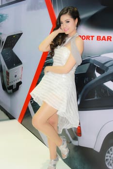 BANGKOK, THAILAND - MARCH 30, 2014: Unidentified female presenter pose in the 35th Bangkok International Motor Show on March 30, 2014 in Bangkok, Thailand.