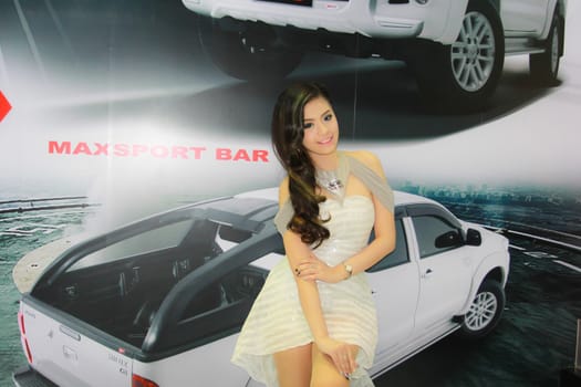 BANGKOK, THAILAND - MARCH 30, 2014: Unidentified female presenter pose in the 35th Bangkok International Motor Show on March 30, 2014 in Bangkok, Thailand.