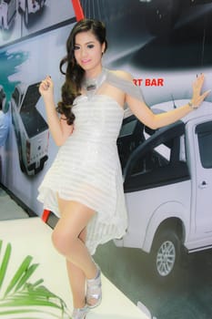 BANGKOK, THAILAND - MARCH 30, 2014: Unidentified female presenter pose in the 35th Bangkok International Motor Show on March 30, 2014 in Bangkok, Thailand.