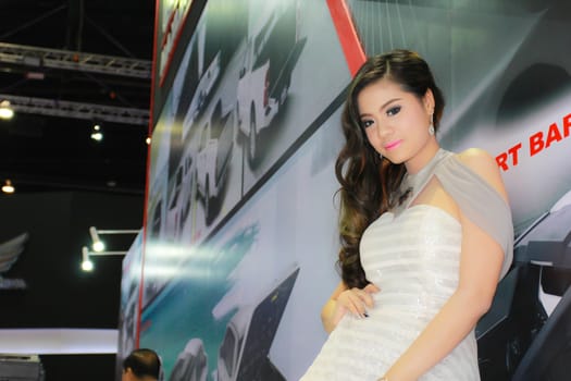 BANGKOK, THAILAND - MARCH 30, 2014: Unidentified female presenter pose in the 35th Bangkok International Motor Show on March 30, 2014 in Bangkok, Thailand.