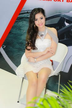 BANGKOK, THAILAND - MARCH 30, 2014: Unidentified female presenter pose in the 35th Bangkok International Motor Show on March 30, 2014 in Bangkok, Thailand.