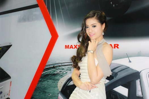 BANGKOK, THAILAND - MARCH 30, 2014: Unidentified female presenter pose in the 35th Bangkok International Motor Show on March 30, 2014 in Bangkok, Thailand.