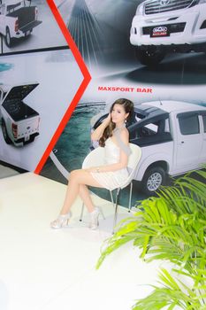 BANGKOK, THAILAND - MARCH 30, 2014: Unidentified female presenter pose in the 35th Bangkok International Motor Show on March 30, 2014 in Bangkok, Thailand.