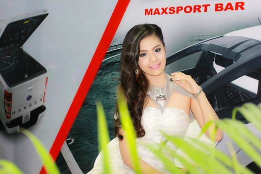 BANGKOK, THAILAND - MARCH 30, 2014: Unidentified female presenter pose in the 35th Bangkok International Motor Show on March 30, 2014 in Bangkok, Thailand.