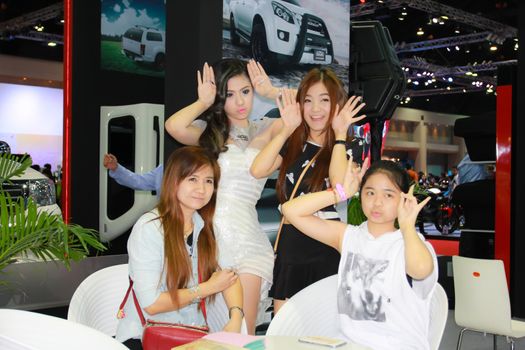 BANGKOK, THAILAND - MARCH 30, 2014: Unidentified female presenter pose in the 35th Bangkok International Motor Show on March 30, 2014 in Bangkok, Thailand.