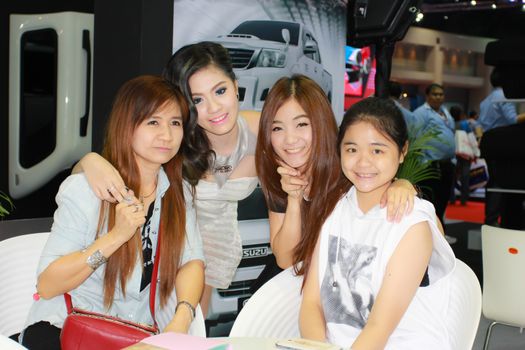 BANGKOK, THAILAND - MARCH 30, 2014: Unidentified female presenter pose in the 35th Bangkok International Motor Show on March 30, 2014 in Bangkok, Thailand.