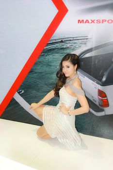 BANGKOK, THAILAND - MARCH 30, 2014: Unidentified female presenter pose in the 35th Bangkok International Motor Show on March 30, 2014 in Bangkok, Thailand.