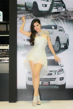 BANGKOK, THAILAND - MARCH 30, 2014: Unidentified female presenter pose in the 35th Bangkok International Motor Show on March 30, 2014 in Bangkok, Thailand.