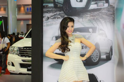 BANGKOK, THAILAND - MARCH 30, 2014: Unidentified female presenter pose in the 35th Bangkok International Motor Show on March 30, 2014 in Bangkok, Thailand.